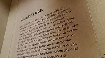 Photo of an exhibit panel titled Curator's Note