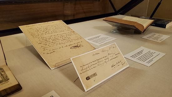 Photo of documents on display in exhibit case