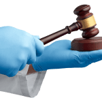 Hands wearing blue medical gloves and holding a gavel