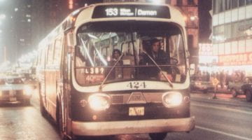CTA Bus at the intersection of State & Randolph at night. 1978.