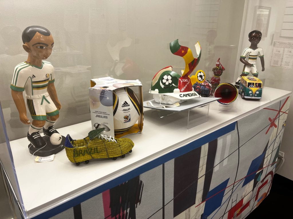 Chasing the exhibit featuring statuettes and other art from the 2010 World Cup in South Africa