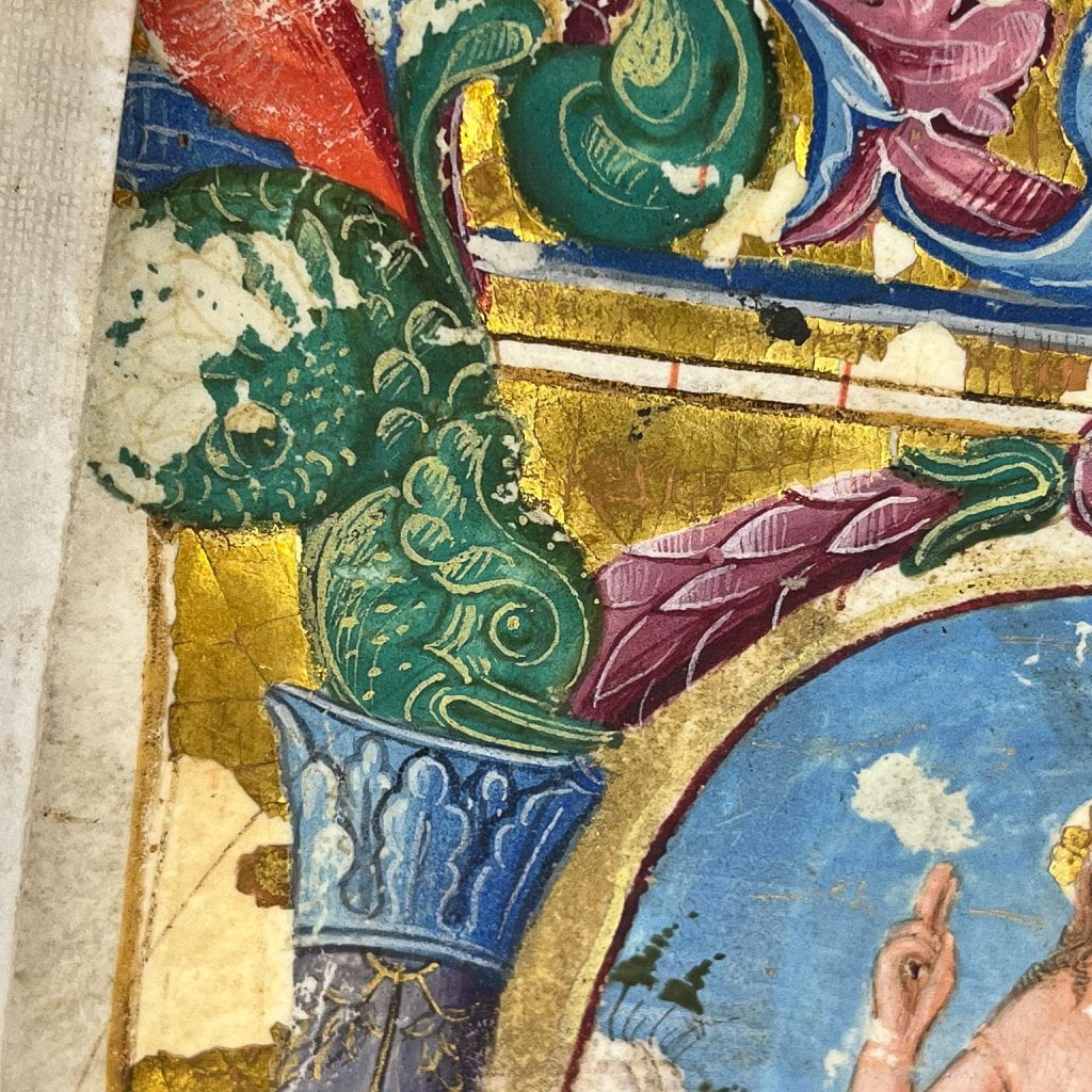 Detail of first illumination with areas of pigment loss showing the under-drawing