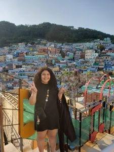 Photo: Me posing in front of Gamcheon Cultural Village, a tourist attraction in Busan, South Korea that features hundreds of colorfully painted houses. Taken by a lovely classmate from Europe. 