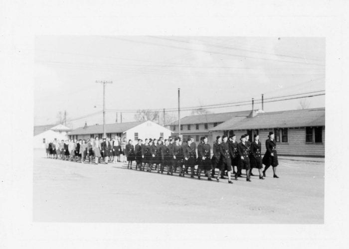 Women in uniform marching at Fort Custer