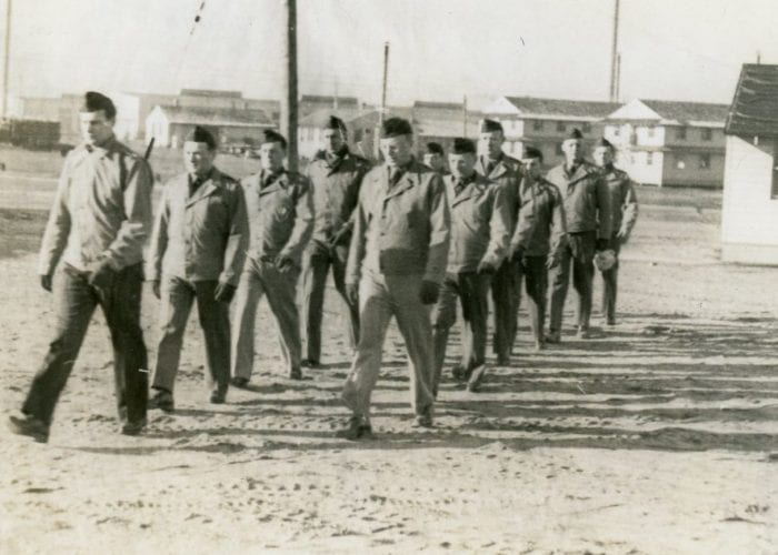 Men marching at Fort Custer